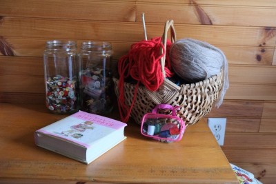 Two Jars of Mother's Buttons, One Basket of Wool Yarn I Hope to Use Someday, a Pretty Book from My Friend Olive, and the $1 Sewing Kit
