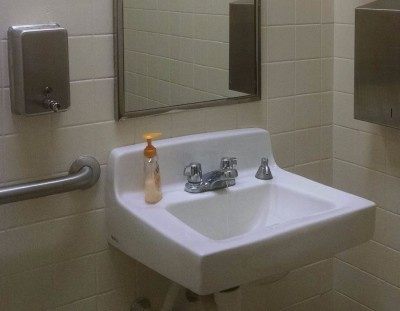 Two Built-In Soap Dispensers . . . with a Plastic Bottle of Soap on the Sink