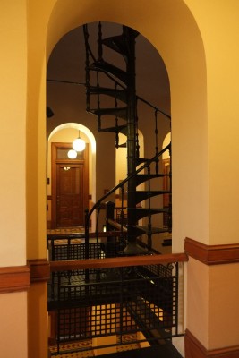 Spiral staircase through archway