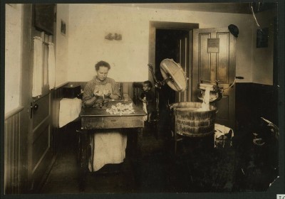 Another woman makes toothbrushes in her home in Leeds in 1912