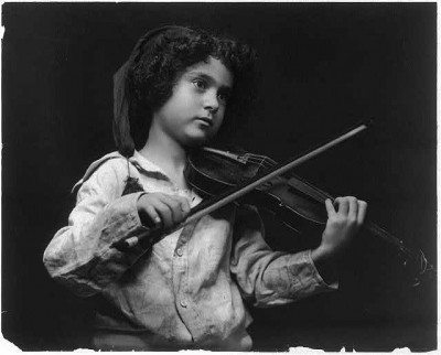 Undated picture of a child playing a violin. Courtesy Library of Congress