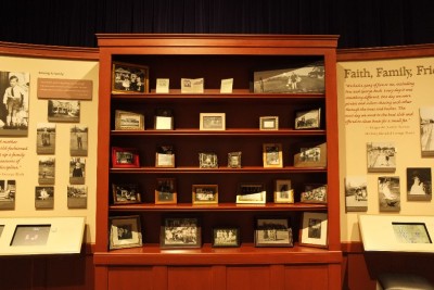 Nestled between two of the many museum display panels was this shelf with family pictures that beautifully illustrated the loving family from which he came.