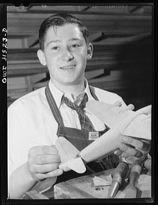 Oswego, New York. Oswego high school boy who made seventy model planes for the Navy, and was awarded honorary rank of Admiral