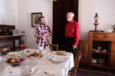 Ray with curator Cory Robinson in the dining room of one of the fort's officers quarters.