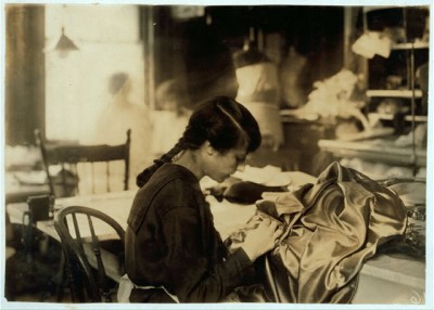 Teen girl works as a dressmaker. Courtesy Library of Congress.