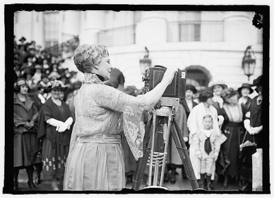 First lady Florence Harding operates a movie camera on the grounds of the White House, 1922. Courtesy Library of Congress.