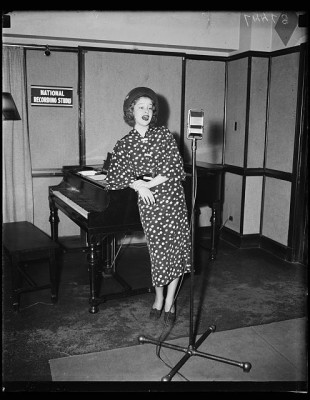 Woman singing at microphone, National Recording Studio, 1935. Courtesy Library of Congress.