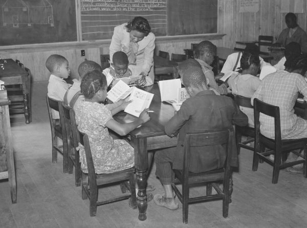 Teacher and students in Prairie Farms, Alabama, 1939. Courtesy Library of Congress.